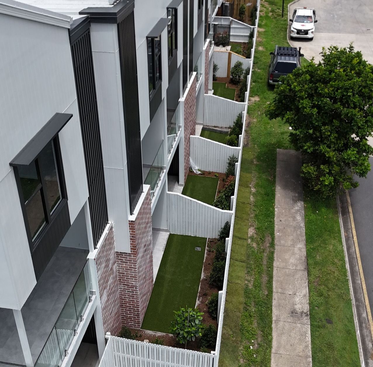 Newly landscaped garden beds and turf at the Fable Townhouse Development in Everton Park